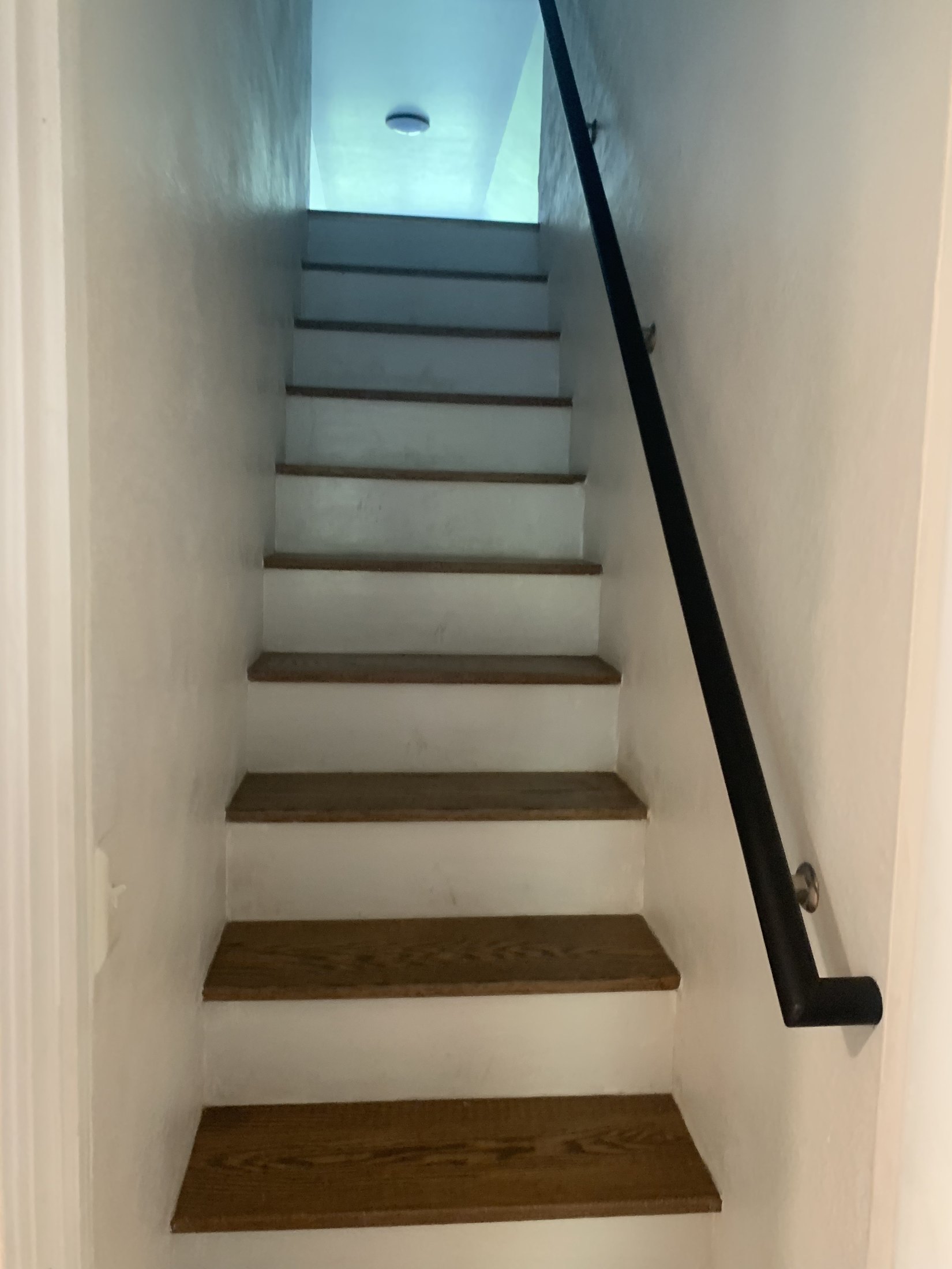 Renovated attic stair with oak treads and white risers