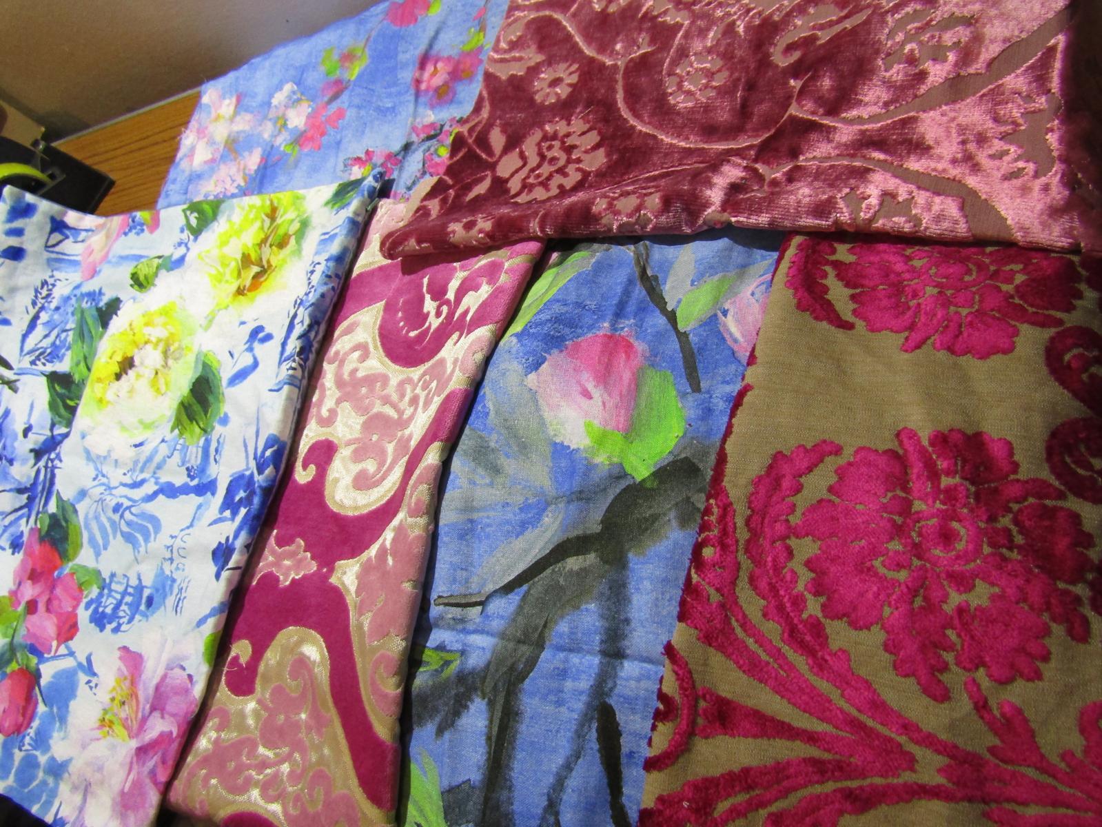 Designers Guild Majolica and coordinating patterned fabrics in blue, pink, green, and gold