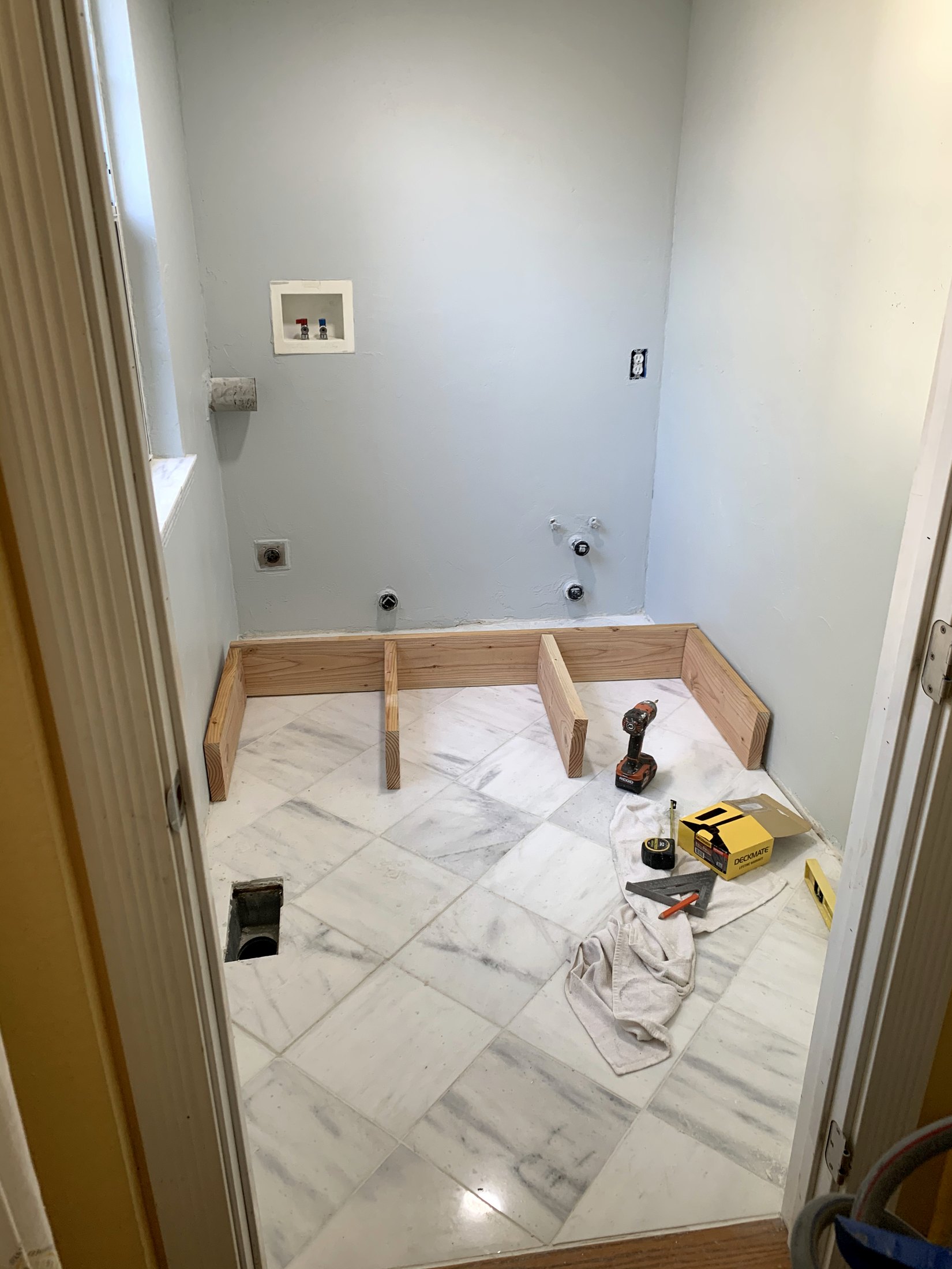 Laundry room marble floor nearing completion