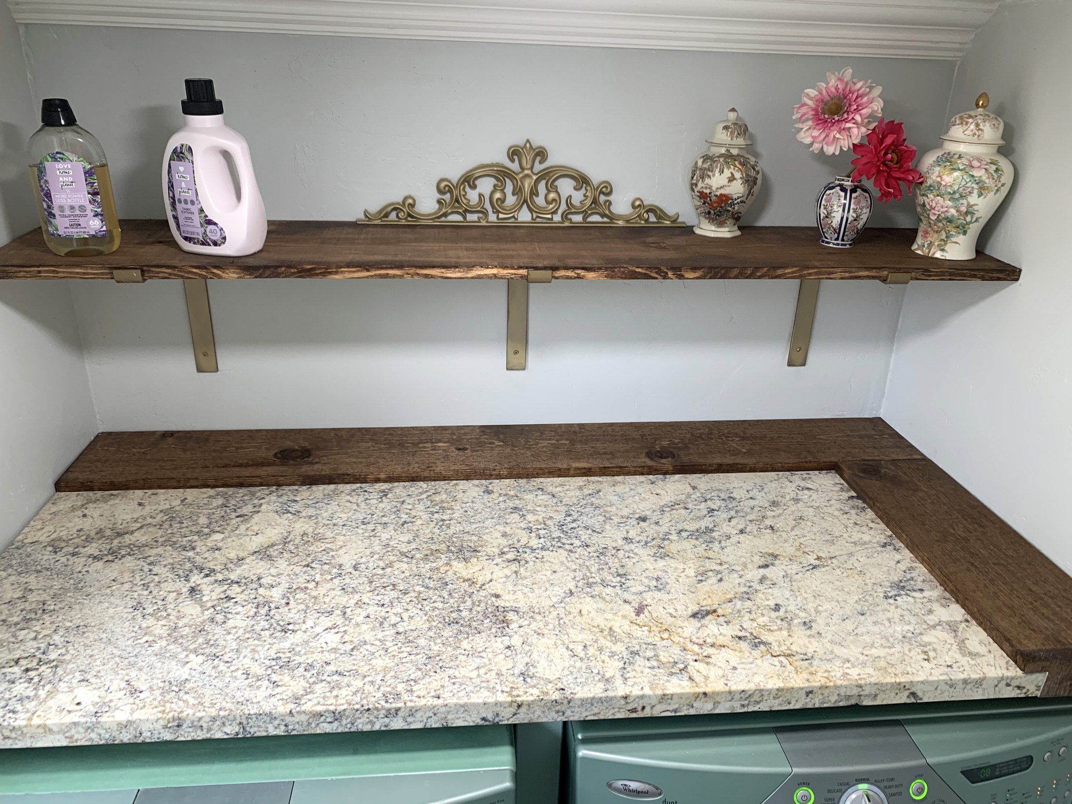 Laundry folding counter and shelf with a detailed stone work surface
