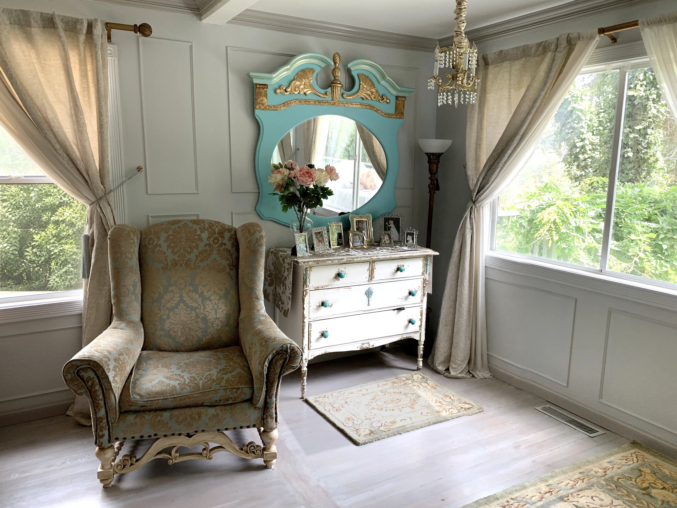 Finished California farmhouse living room with paneled walls and a view into the garden