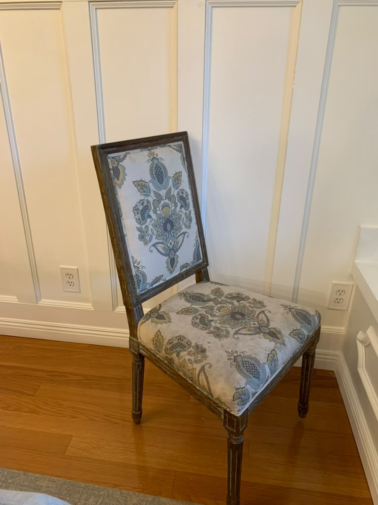 Original pale floral upholstery on the back of the dining chair before it was replaced with Ombrione