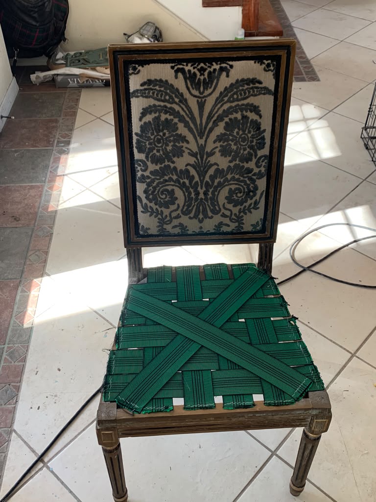 Dining chair being rebuilt by hand in the Crown Equus Atelier