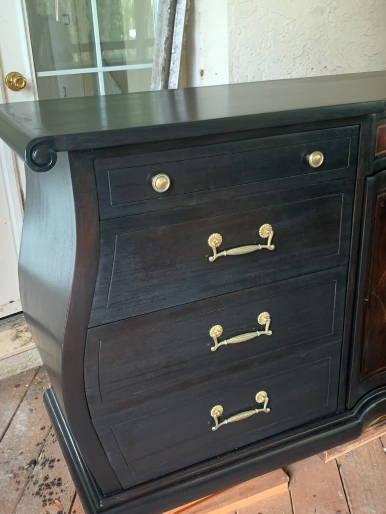 Close view of the sideboard's restored drawers and brass handles